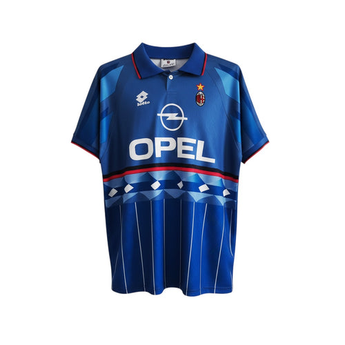 Hinchas Sportswear Store AC Milan 1995 retro blue Lotto jersey with Opel sponsor and geometric patterns.