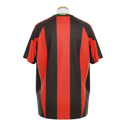 Hinchas Sportswear Store AC Milan 2010-11 retro home jersey, red and black vertical stripes, gold side panels, crew neck.