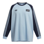 Hinchas Sportswear Store Adidas x Oasis light blue raglan long-sleeve tee with black sleeves and white stripes.