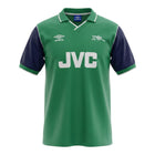 Hinchas Sportswear Store Arsenal 1982 away jersey in green, navy blue, and white with JVC sponsor and cannon crest.