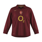 Hinchas Sportswear Store Arsenal 2005/06 retro long sleeve home kit in maroon with gold O2 sponsor and Highbury 1913-2006 detail.