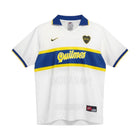 Hinchas Sportswear Store white Boca Juniors 96-97 away jersey with blue and yellow trim, featuring the Quilmes sponsor and Maradona name.