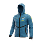 Hinchas Sportswear Store teal blue Brazil National Team Nike Windrunner jacket with CBF crest and yellow Swoosh.