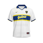 Camiseta blanca de visitante Boca Juniors 1996-97 de Hinchas Sportswear Store con banda azul y amarilla y logo de Quilmes.