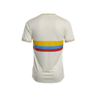 Hinchas Sportswear Store Colombia 100 Years Special Edition Jersey, off-white with yellow, blue, and red chest stripes.