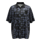 Hinchas Sportswear Store England retro 1990 blackout football jersey with geometric diamond pattern, tonal crest, and black polo collar.
