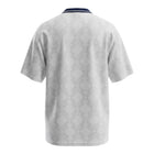 Hinchas Sportswear Store England 1990 retro home jersey, white with all-over tonal geometric pattern, navy collar, and Greek key cuffs.