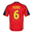 Hinchas Sportswear Store Fernando Hierro Spain retro jersey 1999, red with yellow trim and navy blue accents, number 6 on back.