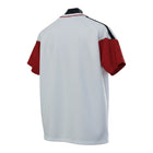 Hinchas Sportswear Store Germany 2026 polo training shirt, white with red sleeves, black shoulder stripes, and ribbed collar.