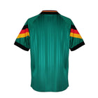 Hinchas Sportswear Store Germany retro 1992 away jersey in emerald green with black collar and German flag sleeve bands.