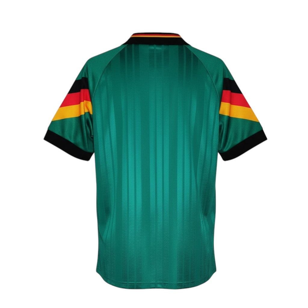 Hinchas Sportswear Store Germany retro 1992 away jersey in emerald green with black collar and German flag sleeve bands.