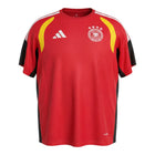 Hinchas Sportswear Store Germany 2026 red, black, and yellow Climacool training jersey with white Adidas stripes on shoulders and DFB crest.