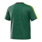 Hinchas Sportswear Store deep green Adidas Originals retro tee with yellow accents, chevron jacquard, and Trefoil logo.