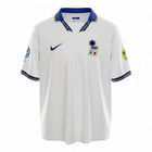 Hinchas Sportswear Store white Italy 1996 Euro away jersey with blue collar and gold trim, Nike logo, FIGC crest, and tournament patches.