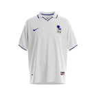 Hinchas Sportswear Store white Italy 1998 World Cup away jersey with navy blue collar trim and cuffs, featuring a navy Nike swoosh and FIGC crest.