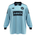 Hinchas Sportswear Store light blue Adidas x Oasis retro long sleeve jersey with white collar and chest logo.