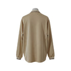 Hinchas Sportswear Store cream long sleeve Liverpool FC 1996/97 away retro jersey with dark brown trim on collar and cuffs.