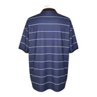 Hinchas Sportswear Store: Manchester United 1999-00 retro away jersey in navy blue with white pinstripes and black polo collar.