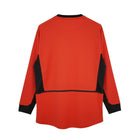 Hinchas Sportswear Store Manchester United 2002-03 red long sleeve retro jersey with black side panels and collar trim.