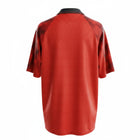 Hinchas Sportswear Store Manchester United 1996/97 retro home jersey, red with tartan sleeves and white polo collar.
