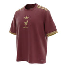Hinchas Sportswear Store Mexico de Oro burgundy football jersey with gold Aztec pattern, Adidas stripes, and crest.