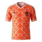 Hinchas Sportswear Store Netherlands retro 1988 home football kit. Iconic orange jersey with white Adidas stripes and crest.