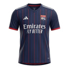 Hinchas Sportswear Store Olympique Lyon 2025/26 navy blue away jersey with red and blue vertical stripes, embroidered crest, and white Emirates Fly Better logo.