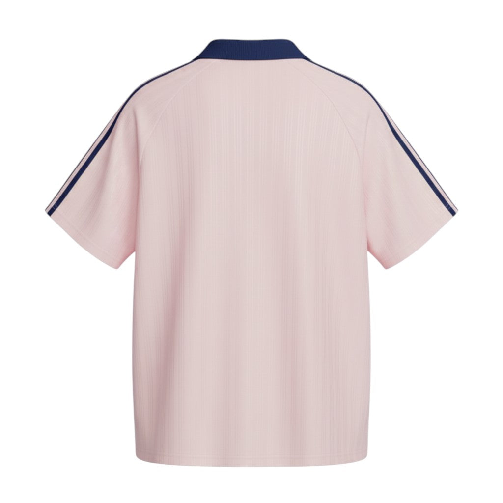 Hinchas Sportswear Store pink jacquard polo tee with navy collar and Adidas stripes.