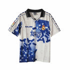 Hinchas Sportswear Store Real Madrid 1996-97 retro third jersey, white with blue geometric pattern, black collar, Kelme and Teka branding.
