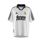 Hinchas Sportswear Store Real Madrid 1998-99 retro home jersey. White Adidas shirt with navy and yellow striped polo collar, Teka sponsor, and Centenary badge.
