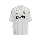Hinchas Sportswear Store white Adidas Real Madrid 2011-12 retro jersey with gold trim and bwin sponsor.